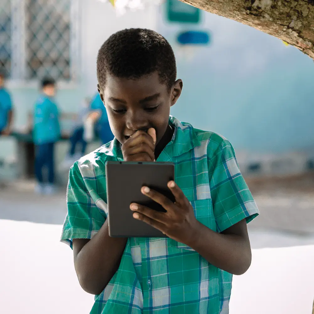 Kid at school looking at a tablet